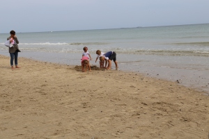 Some adorable French children playing on Utah Beach.