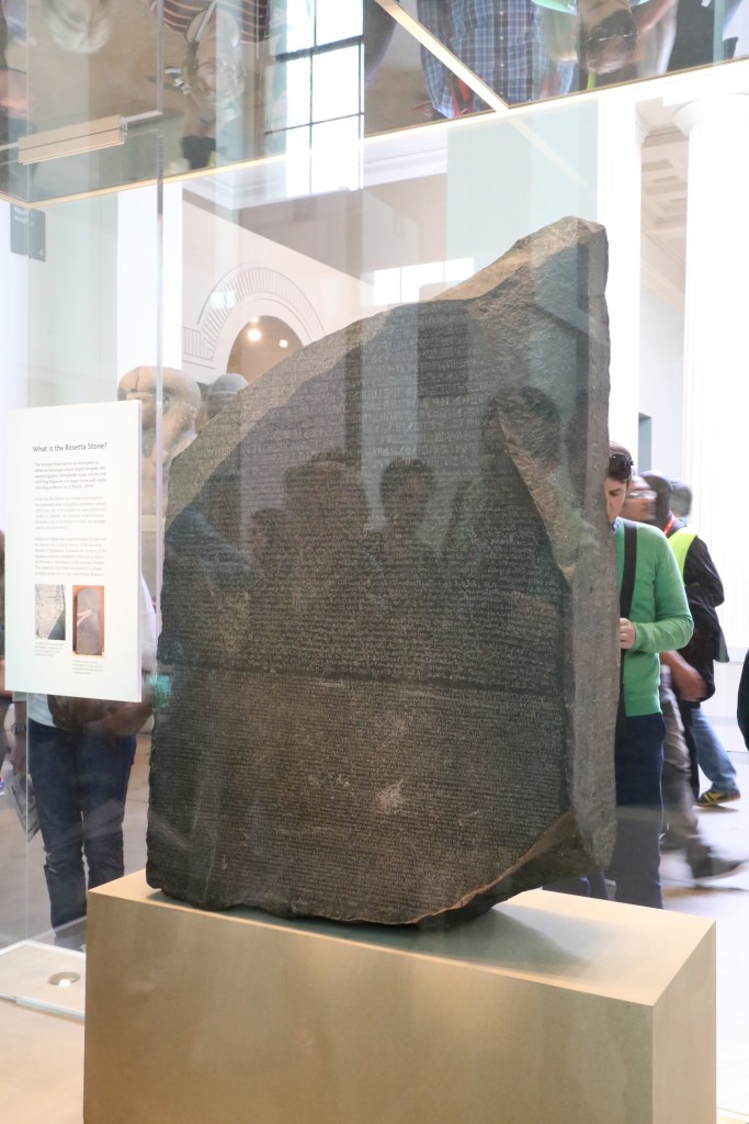 This rather awful picture shows the Rosetta Stone, perhaps the most famous in the Museum's collection. Its discovery in 1799 allowed scholars to  map hieroglyphs to Greek and understand their meaning for the first time.