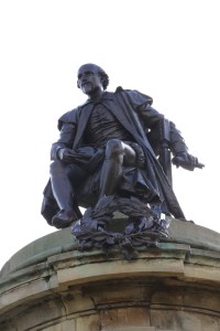 Shakespeare statue along the Avon River. The statue is surrounded by four of his most famous characters.