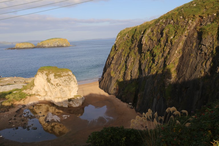 This cliff in Ballintoy Harbor is used for Dragonstone. The little beach there is where Gendry set off in his little boat.
