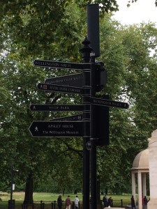 Sign outside Hyde Park Circle directing visitors to iconic London sites.