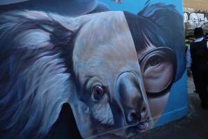 This intriguing mural also takes up the side of a building. 