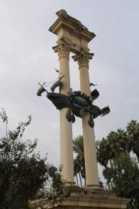 This column commemorates the bringing together of Spain and the Americas - Ferdinand is written on the boat on this side. Isabel is on the other. Parrots were perched up in the boat. 