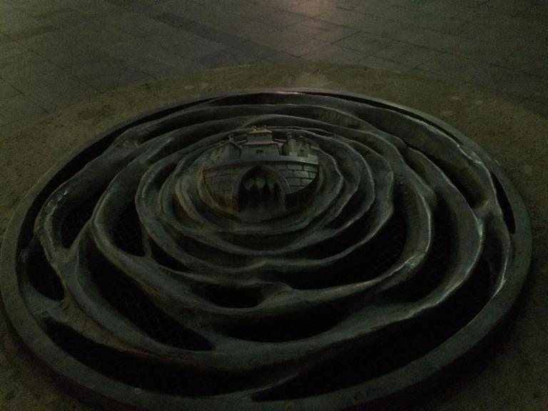 Statue in Old Town - the three-spire castle is a motif of Bratislava