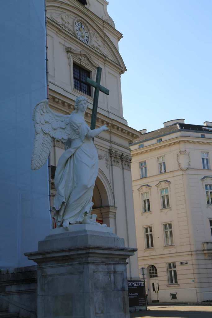 One of the two angels in front of the church