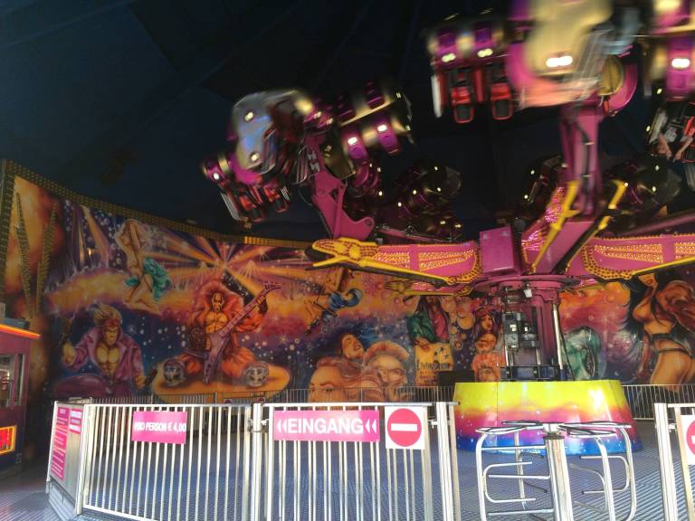 This ride played German techno music crazy loud, and check out the art behind the ride. 